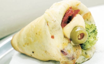 A pizza de cone é a especialidade da pizzaria